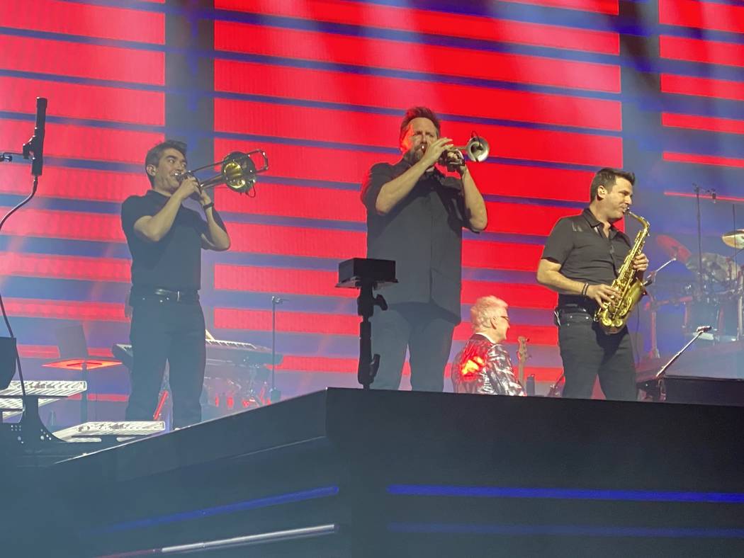 Nathan Tanouye,Matt Fronke and Eric Tewalt are shown performing with Celine Dion at Bridgestone ...