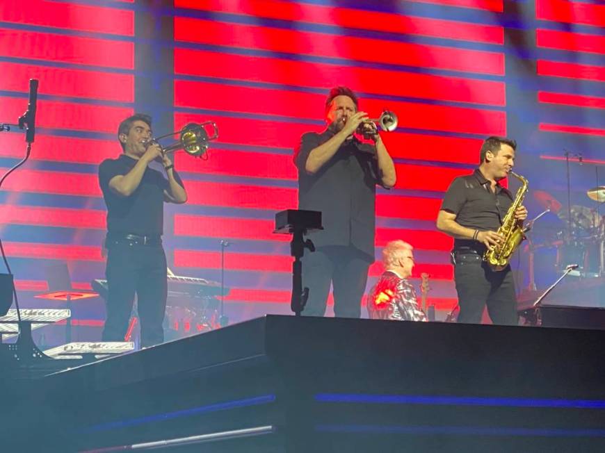 Nathan Tanouye,Matt Fronke and Eric Tewalt are shown performing with Celine Dion at Bridgestone ...