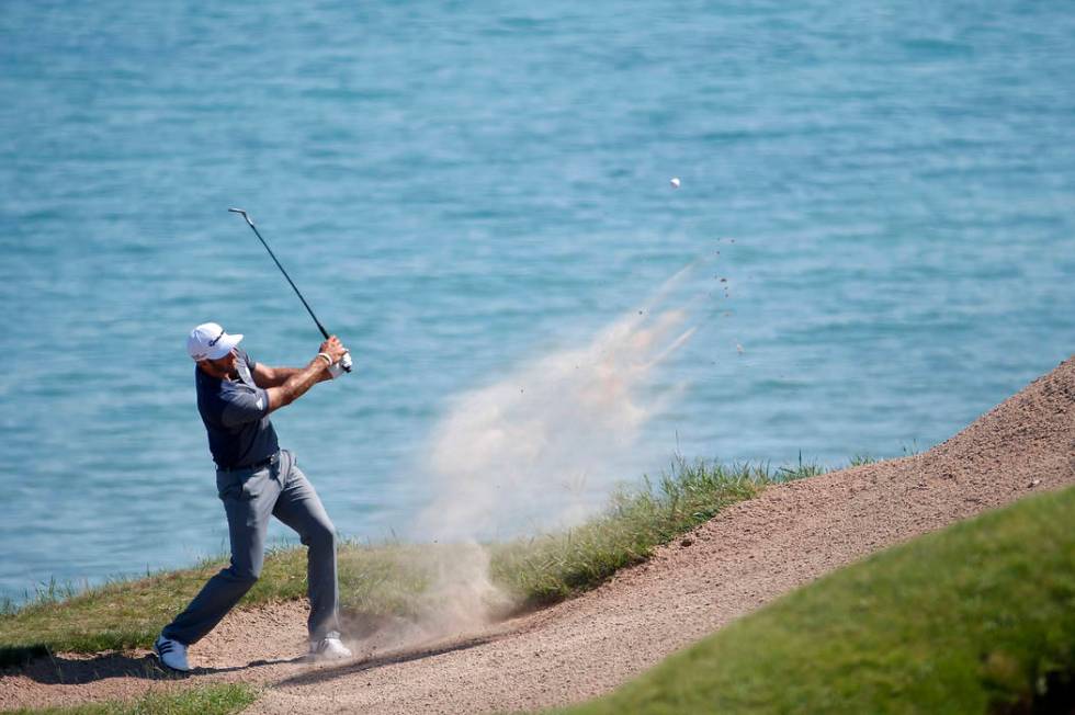 Dustin Johnson hits from a bunker on the third hole during the third round of the PGA Champions ...