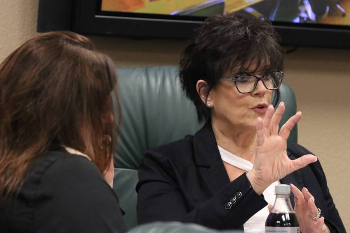 Nevada State Board of Dental Examiners executive director, Debra Shaffer-Kugel, right, speaks a ...