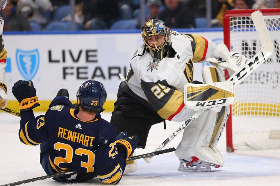 Buffalo Sabres Forward Sam Reinhart (23) and Vegas Golden Knights Goalie Marc-Andre Fleury (29) ...