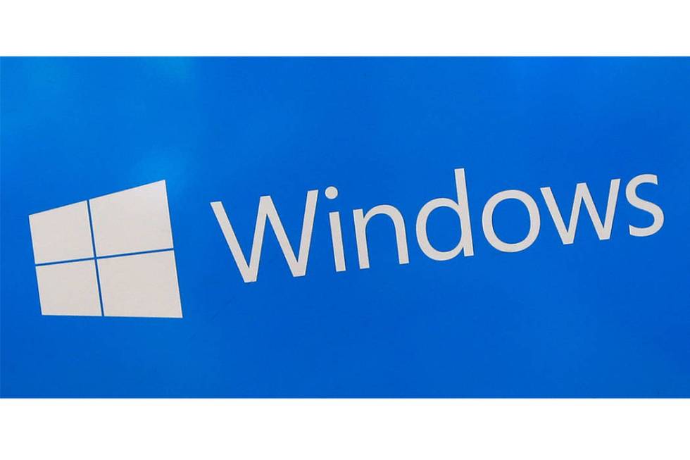 FILE - This Aug. 7, 2017, file shows a Microsoft Windows sign on display at a store in Hialeah, ...