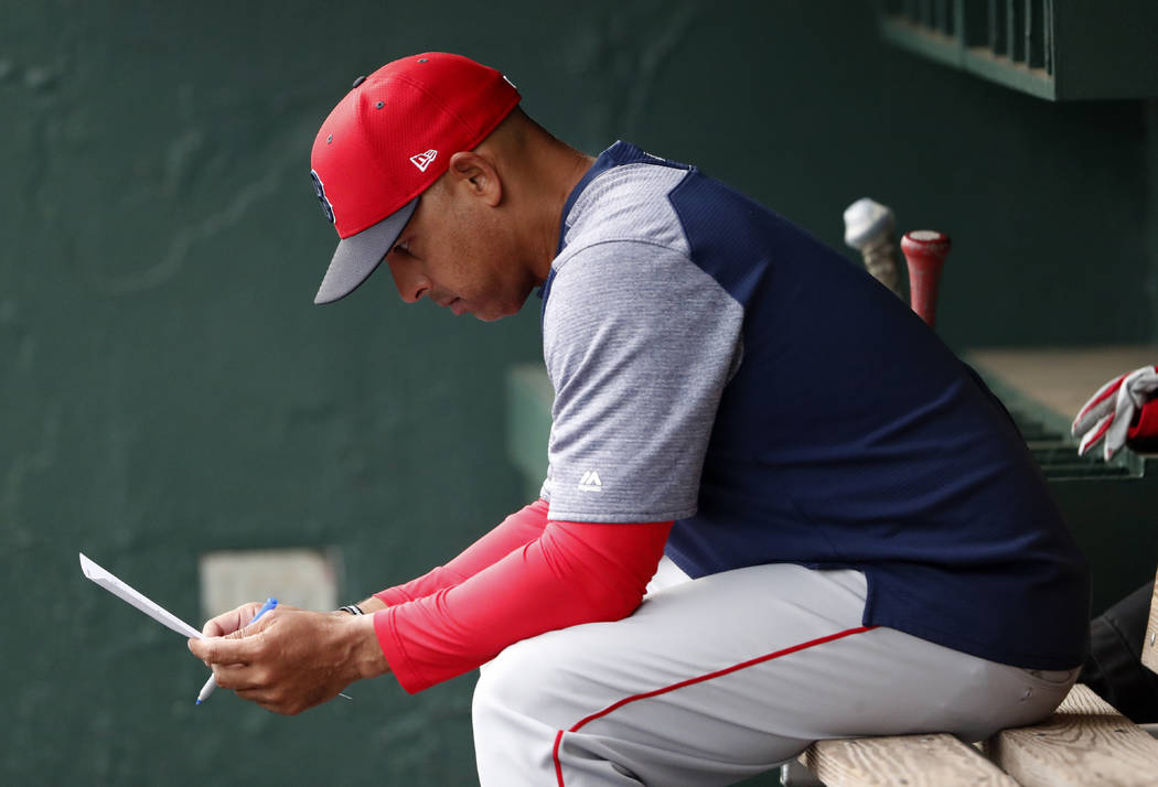FILE - In this March 20, 2019, file photo, Boston Red Sox manager Alex Cora looks over the line ...