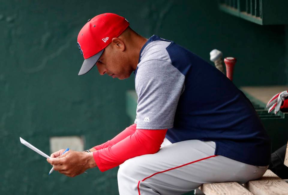 FILE - In this March 20, 2019, file photo, Boston Red Sox manager Alex Cora looks over the line ...