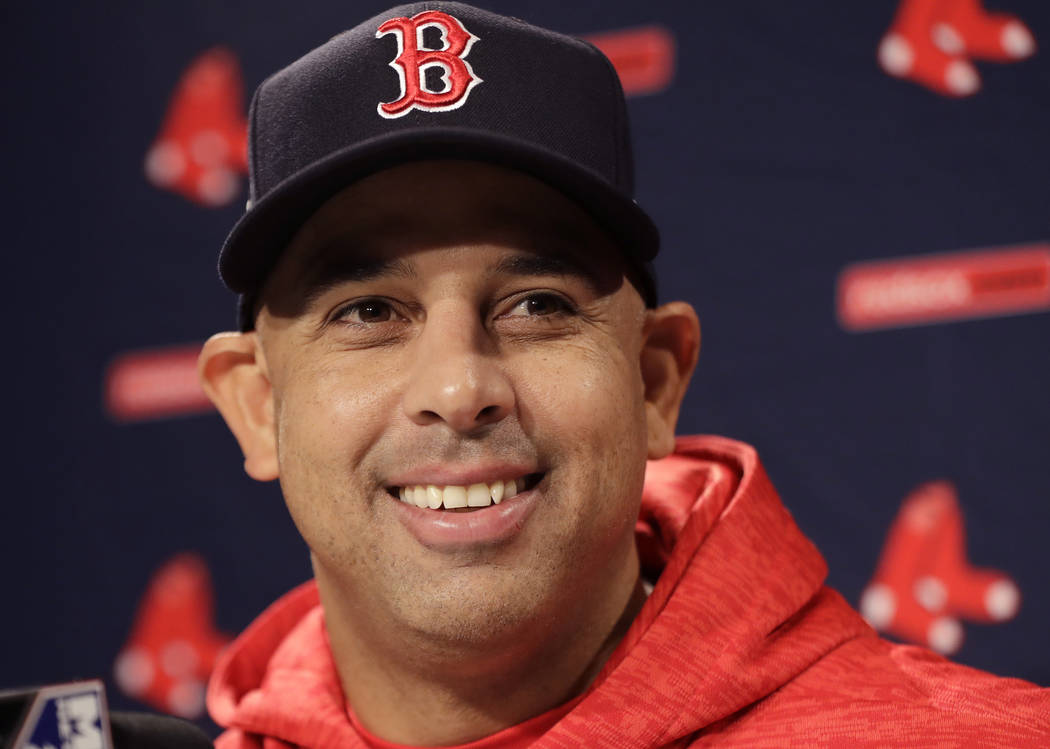 Boston Red Sox manager Alex Cora speaks to media during a baseball work out at Fenway Park, Sun ...