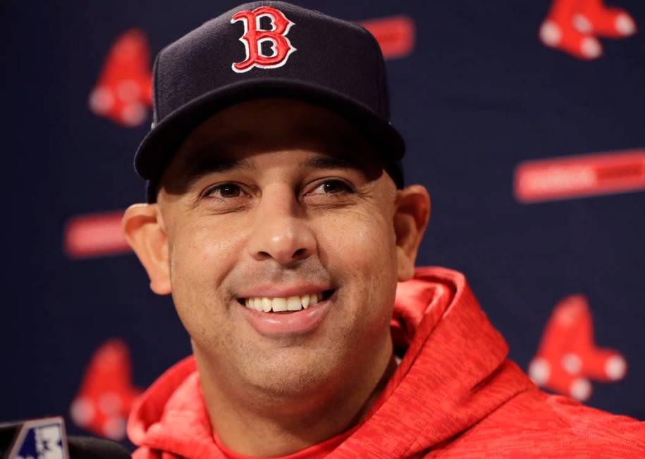 Boston Red Sox manager Alex Cora speaks to media during a baseball work out at Fenway Park, Sun ...