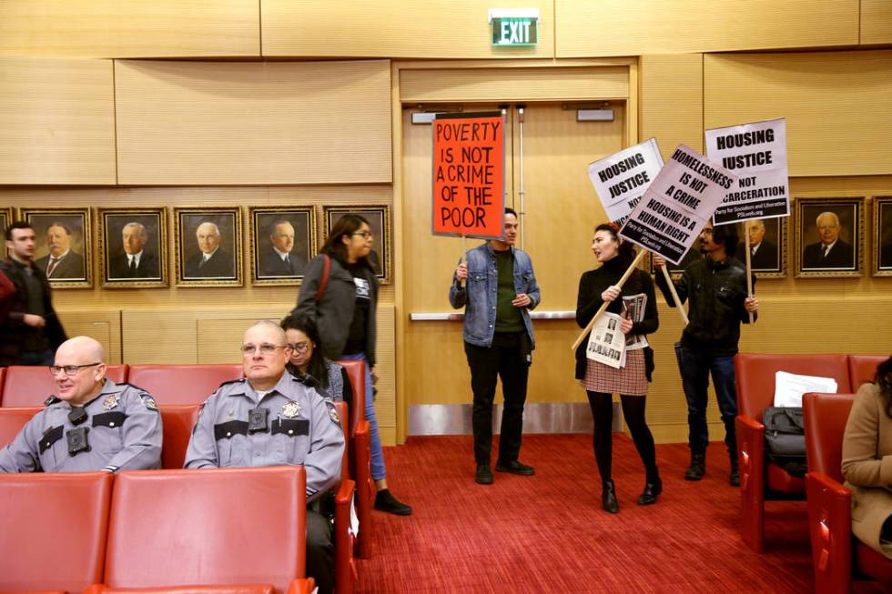 Frank Lopez, from right, Annelise Friedman and Samuel Blasco, all of Las Vegas, arrive at a Las ...