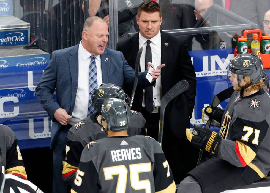 Vegas Golden Knights head coach Gerard Gallant, left, and assistant coach Ryan Craig, right, ta ...