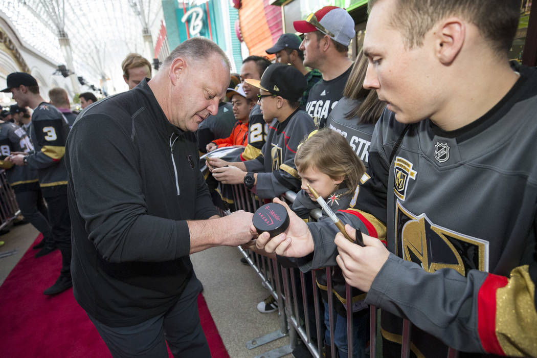 Vegas Golden Knights head coach Gerard Gallant signs autographs during the team's first fan fes ...