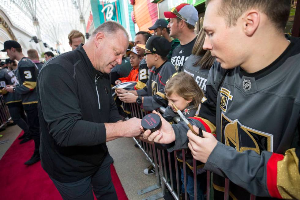 Vegas Golden Knights head coach Gerard Gallant signs autographs during the team's first fan fes ...