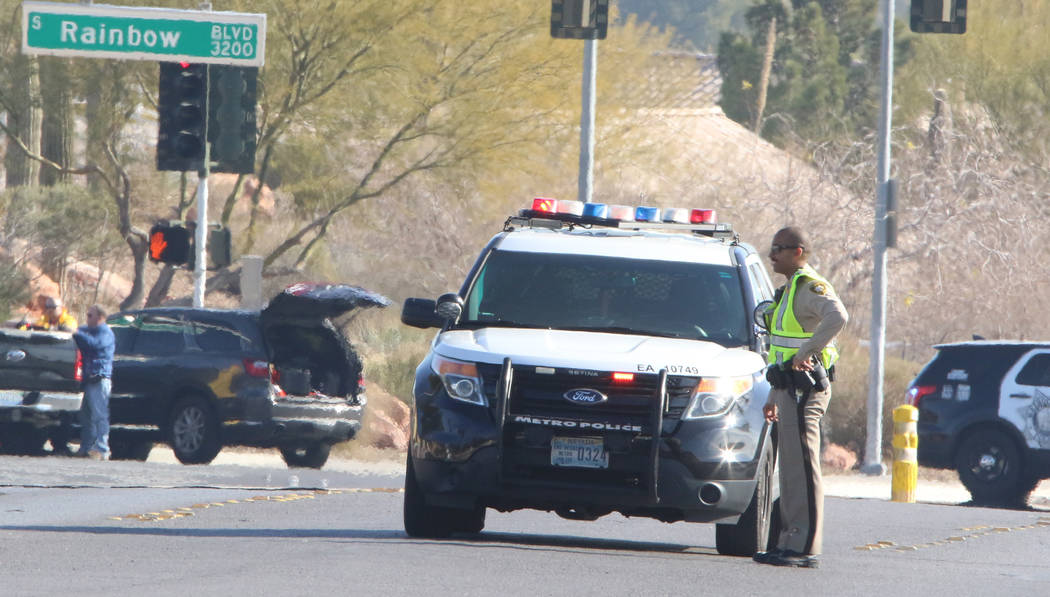 Las Vegas police investigate near Rainbow Boulevard and Darby after an officer-involved shootin ...