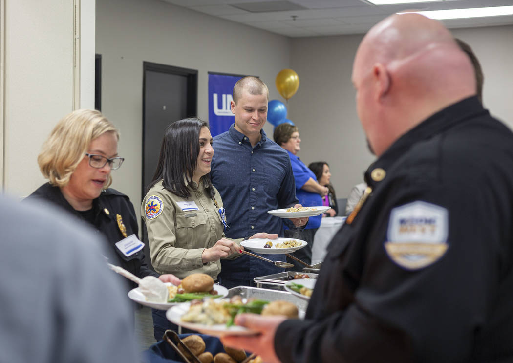 Emergency medical service providers receive lunch during a UMC luncheon to recognize their resp ...