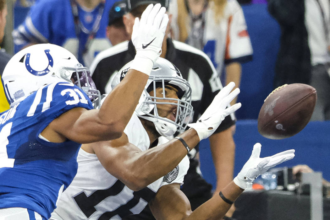 Oakland Raiders wide receiver Tyrell Williams (16) makes a catch for a touchdown in front of In ...