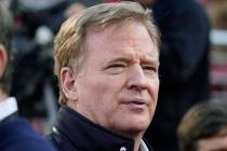 NFL Football Commissioner Roger Goodell watches warmups before an NFL divisional playoff footba ...