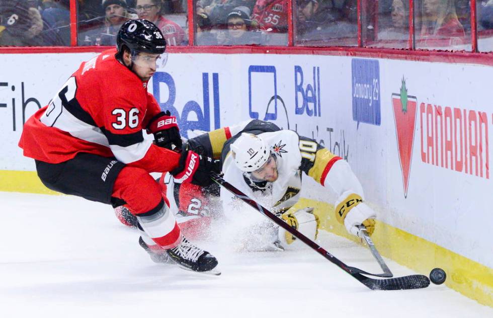 Vegas Golden Knights Nicolas Roy (10) fights for the puck against Ottawa Senators Colin White ( ...