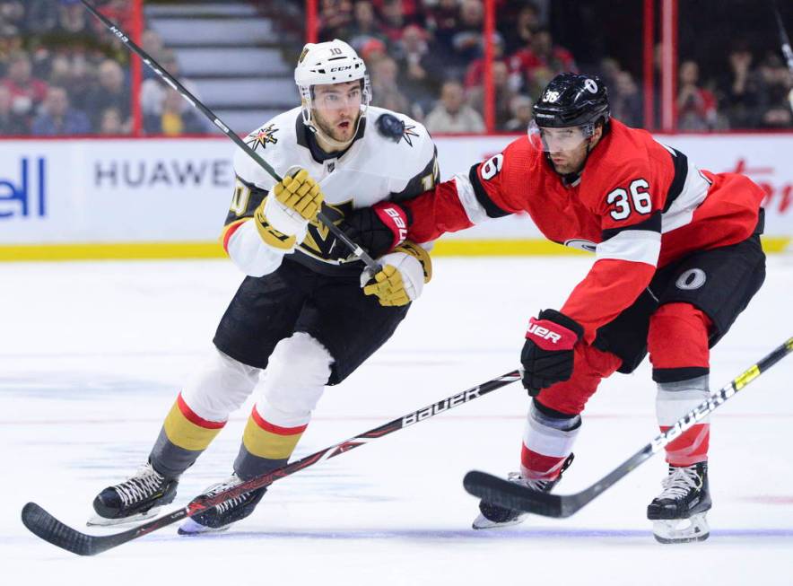 Vegas Golden Knights Nicolas Roy (10) fights for the puck against Ottawa Senators Colin White ( ...