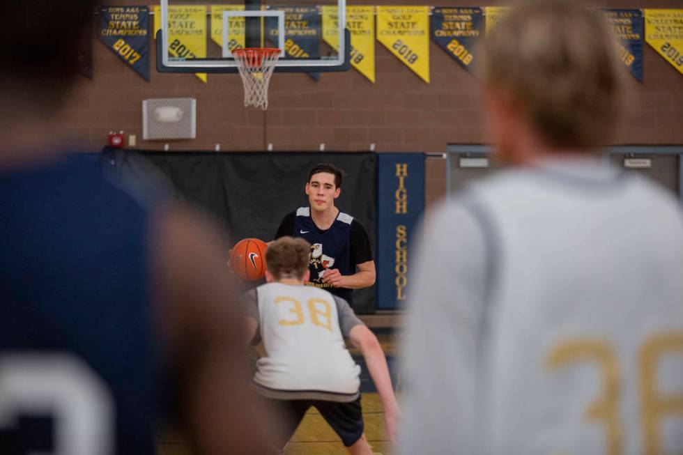 Junior Ethan Speaker (26) leads a drill during practice at Boulder City High School on Wednesda ...