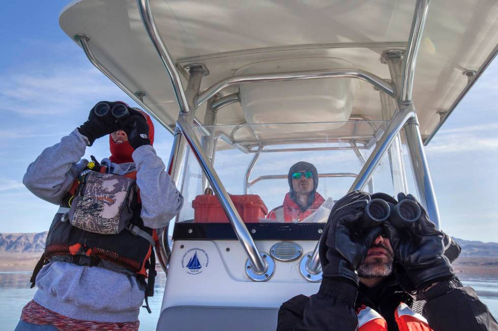 Carrie Norman, left, and Jason Lawor, right, watch for eagles and birds as Alex Swicegood drive ...