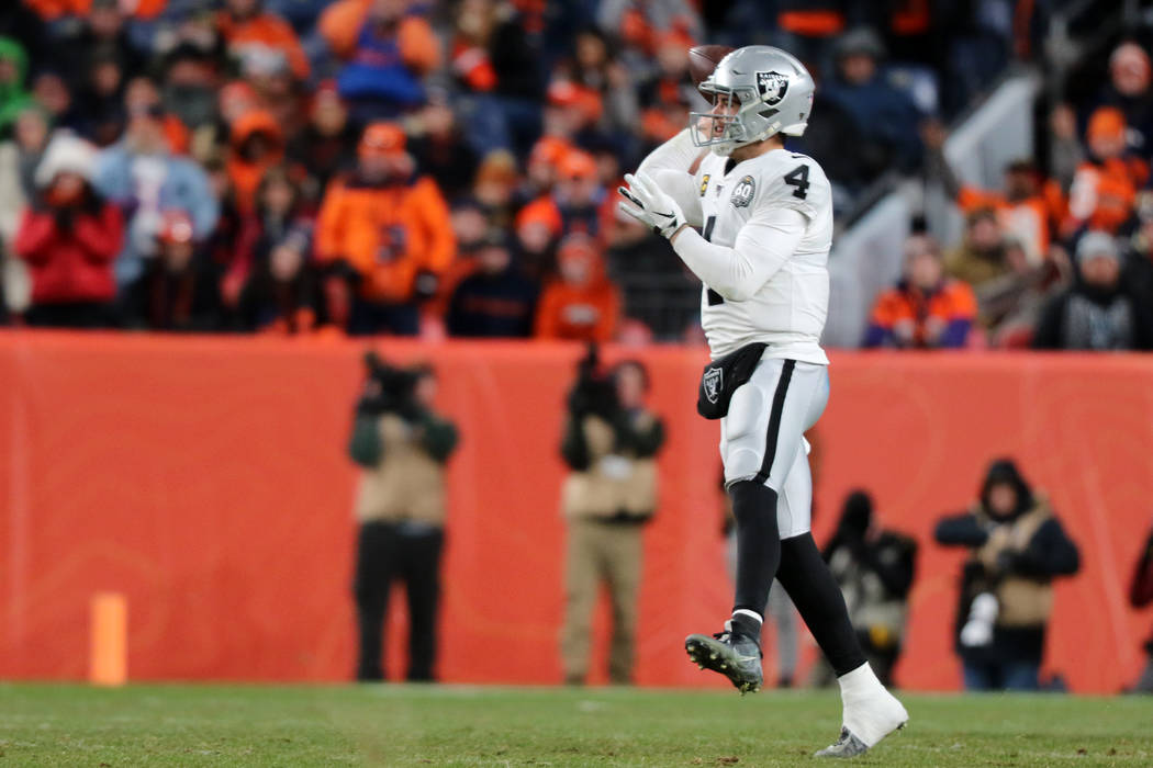 Oakland Raiders quarterback Derek Carr (4) prepares to throw the football during the fourth qua ...