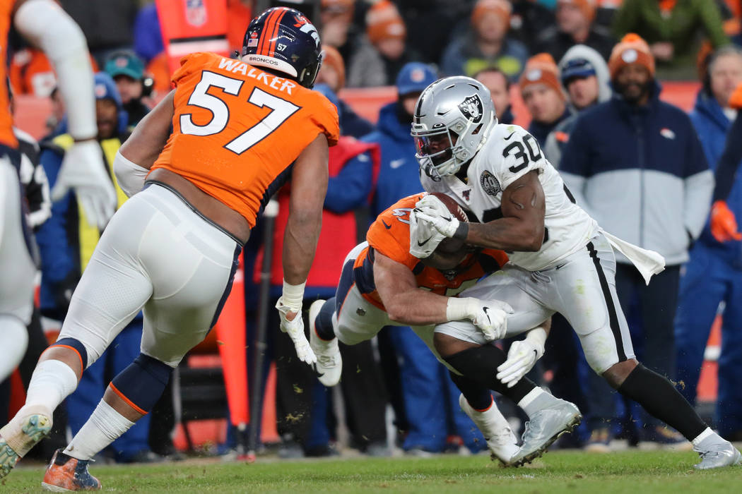 Denver Broncos inside linebacker Josey Jewell (47) tackles Oakland Raiders running back Jalen R ...