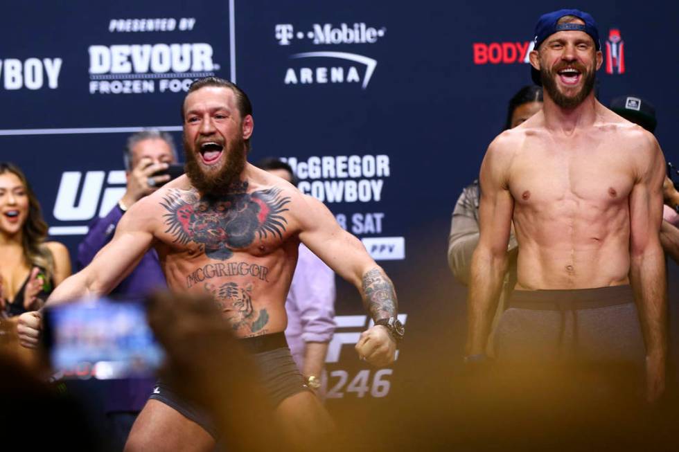Conor McGregor, left, and Donald "Cowboy" Cerrone poses for photos ahead of their wel ...