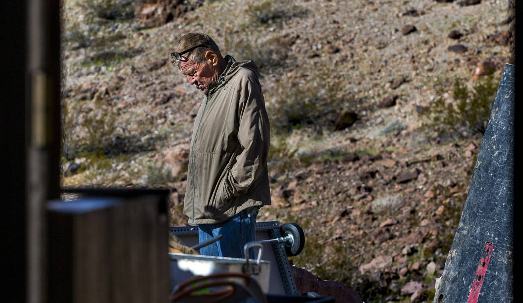 Richard Roman continues to clean out his cave after being evicted by Boulder City in the hills ...