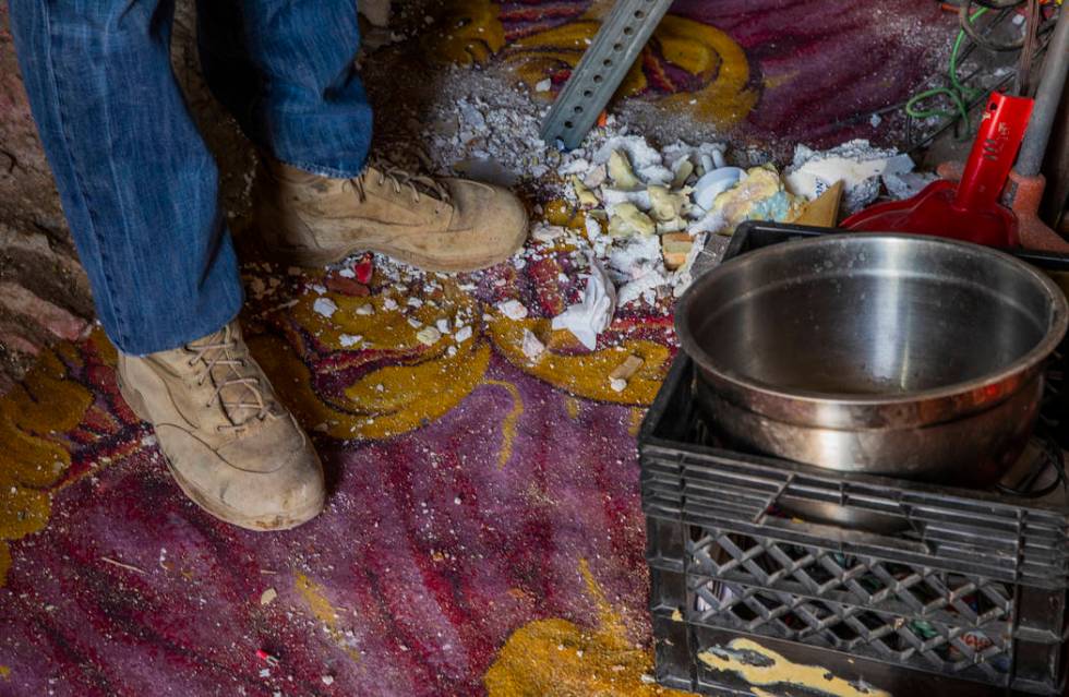 Richard Roman continues to clean out his cave after being evicted by Boulder City in the hills ...