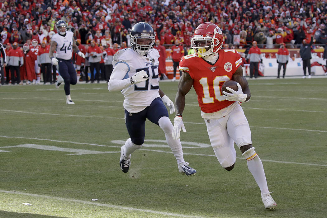 Kansas City Chiefs' Tyreek Hill runs for a touchdown during the first half of the NFL AFC Champ ...