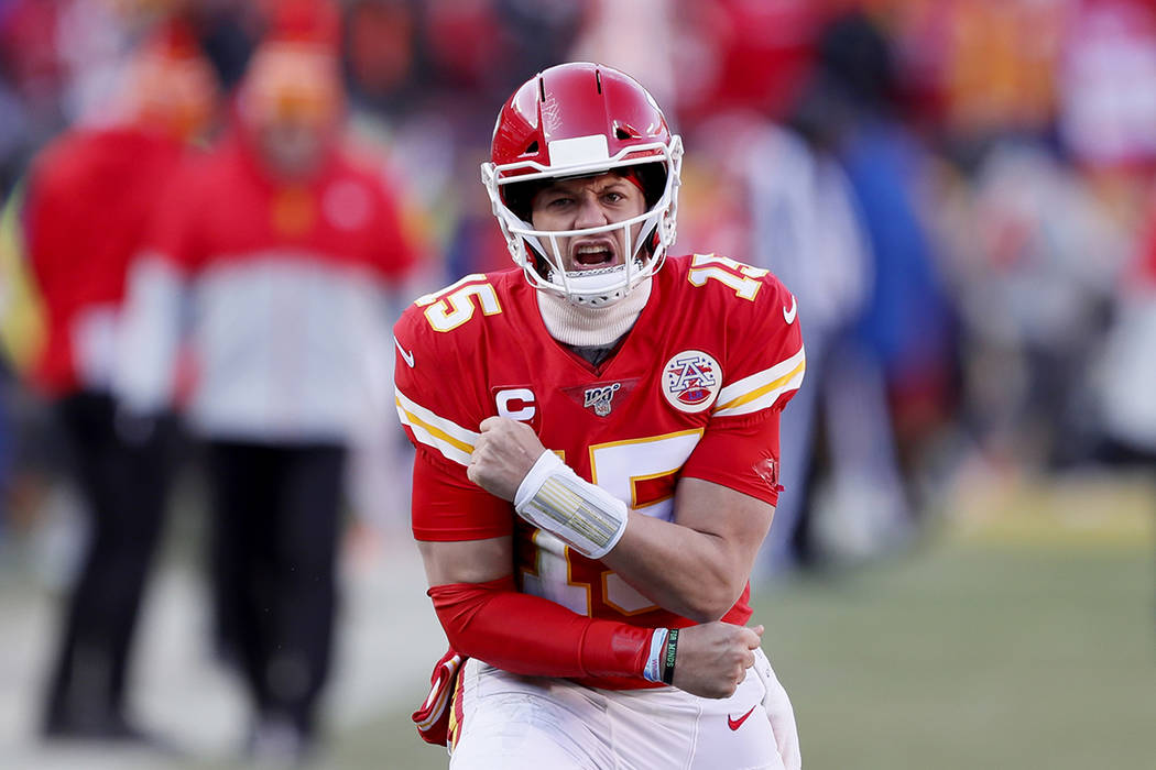 Kansas City Chiefs' Patrick Mahomes reacts after throwing a touchdown pass to Tyreek Hill durin ...