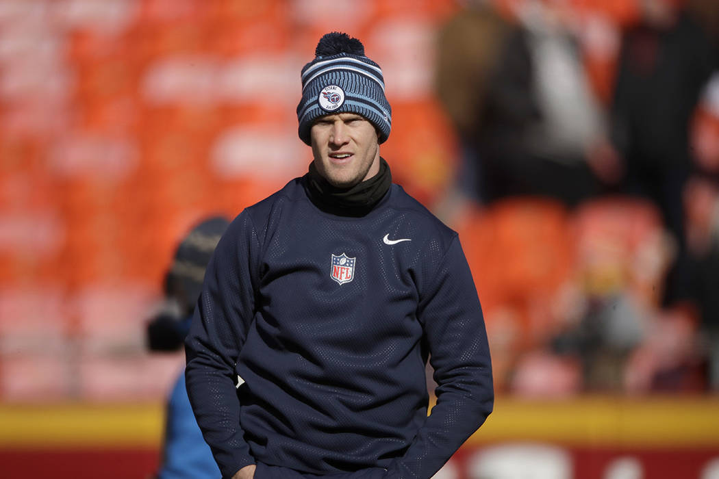 Tennessee Titans' Ryan Tannehill warms up before the NFL AFC Championship football game against ...