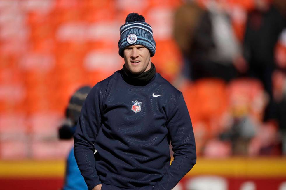 Tennessee Titans' Ryan Tannehill warms up before the NFL AFC Championship football game against ...