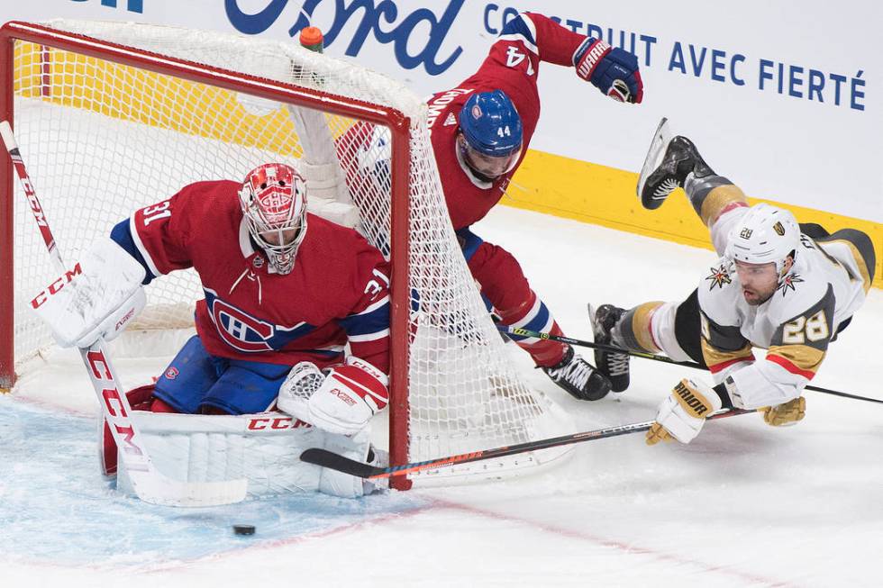 Vegas Golden Knights' William Carrier (28) lunges for the puck as he moves in against Montreal ...