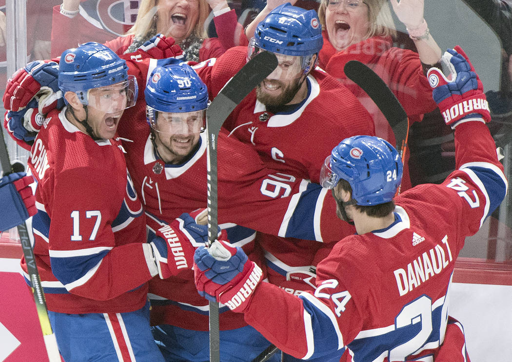 Montreal Canadiens' Ilya Kovalchuk (17) celebrates with teammates Tomas Tatar (90), Shea Weber ...