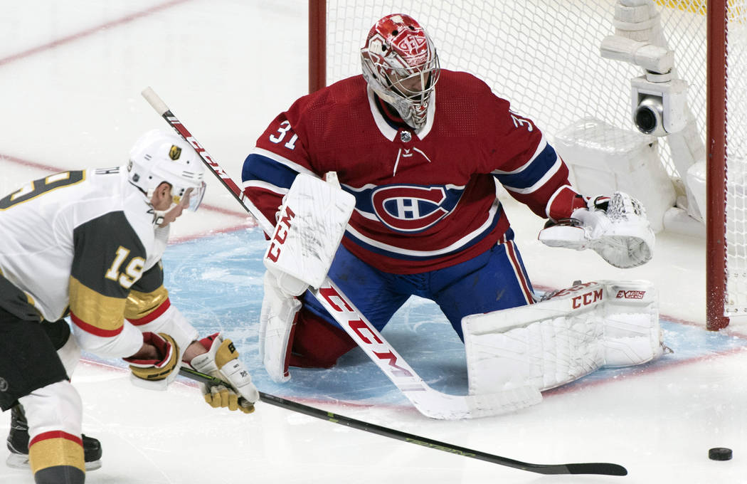 Vegas Golden Knights' Reilly Smith, left, moves in against Montreal Canadiens goaltender Carey ...
