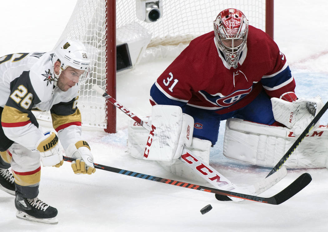 Vegas Golden Knights' Paul Stastny, left, moves in against Montreal Canadiens goaltender Carey ...