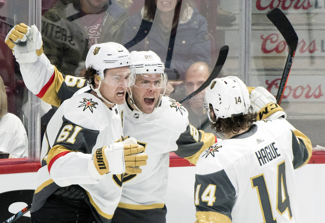 Vegas Golden Knights' Paul Stastny (26) celebrates with teammates Mark Stone (61) and Nicolas H ...
