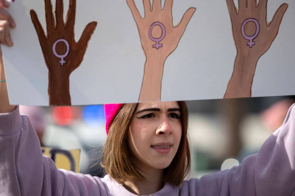 Nico Lemus of Las Vegas participates in the Empowering Women March 2020 on Saturday, Jan. 18, 2 ...