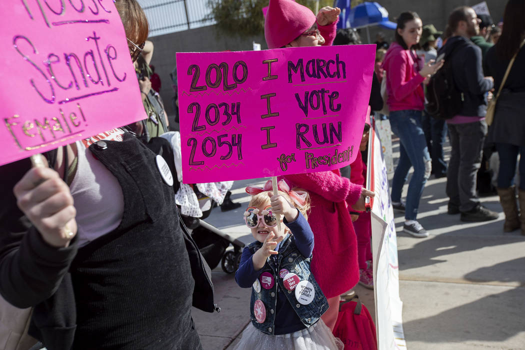 Molly Lynch attends the Empowering Women March 2020 with her daughter McKenzie Fink,4, center, ...