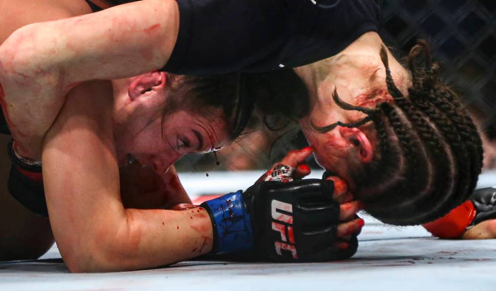 Maycee Barber, left, fights Roxanne Modafferi during their flyweight bout at UFC 246 at T-Mobil ...