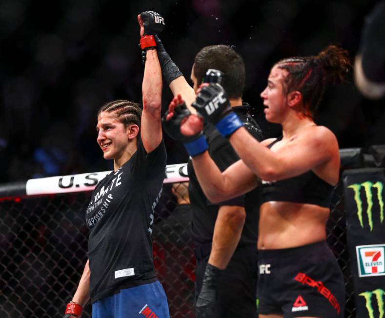 Roxanne Modafferi, left, celebrates her unanimous decision victory over Maycee Barber during th ...