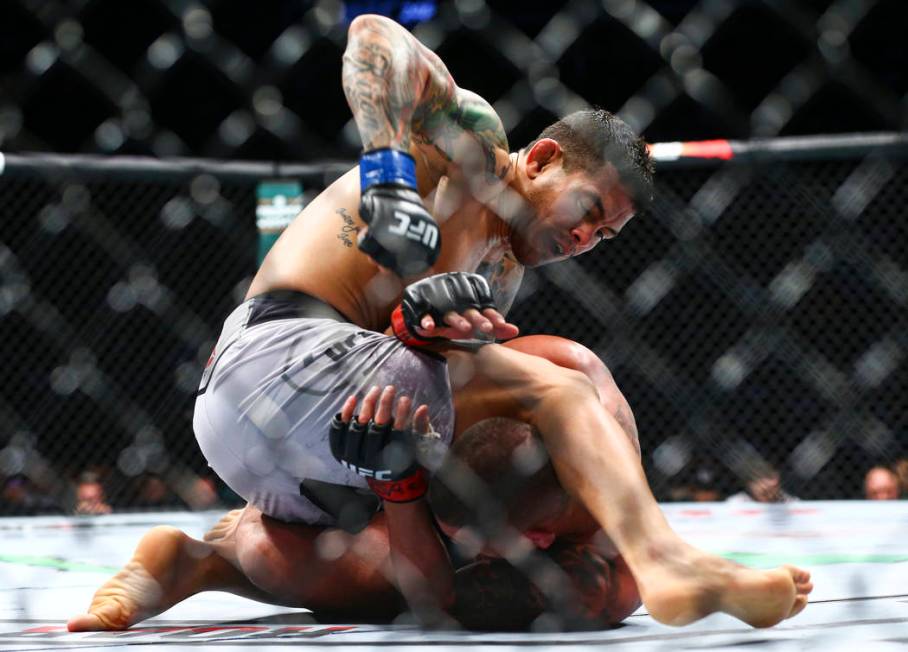 Diego Ferreira, above, fights Anthony Pettis during their lightweight bout at UFC 246 at T-Mobi ...