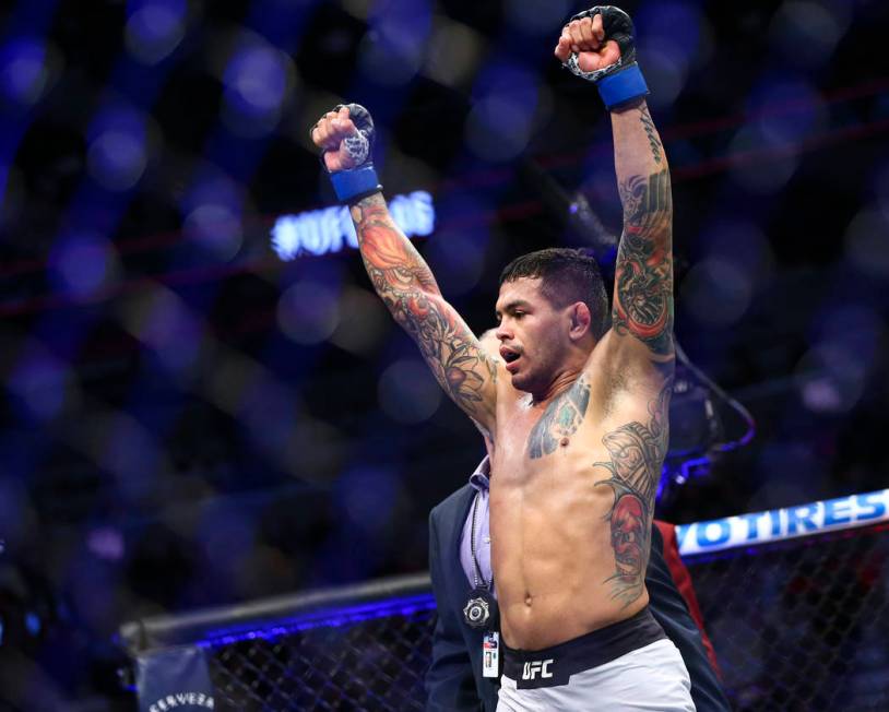 Diego Ferreira celebrates after defeating Anthony Pettis via submission in their lightweight bo ...