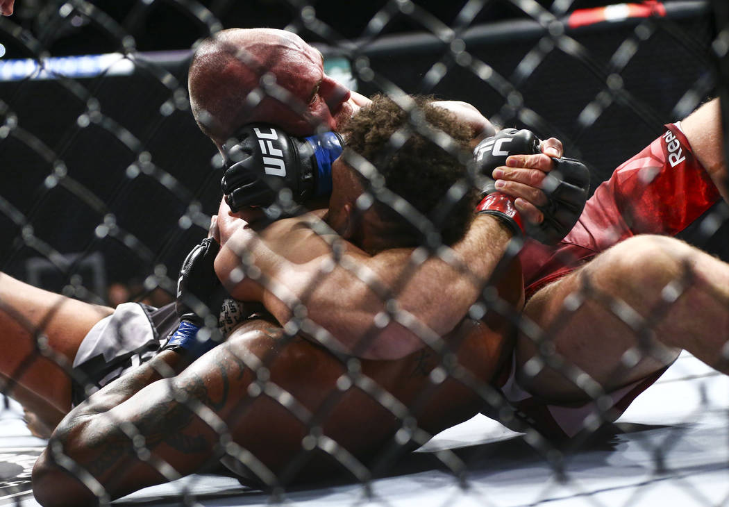 Aleksei Oleinik, above, fights Maurice Greene during their heavyweight bout at UFC 246 at T-Mob ...