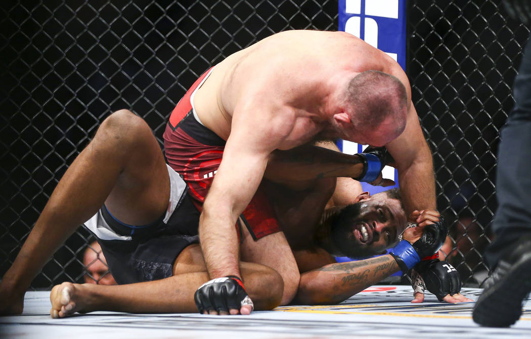 Aleksei Oleinik, above, fights Maurice Greene during their heavyweight bout at UFC 246 at T-Mob ...