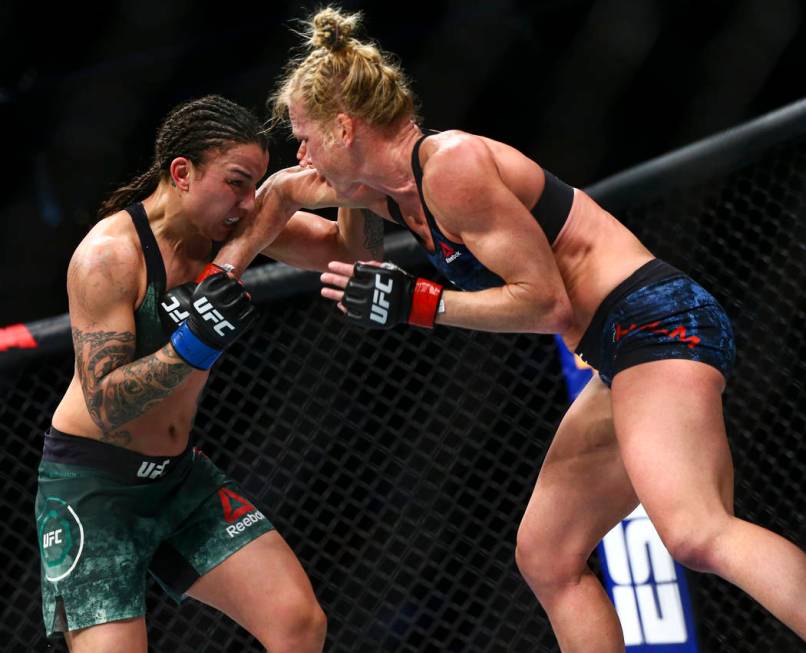 Raquel Pennington, left, fights Holly Holm during their bantamweight bout at UFC 246 at T-Mobil ...