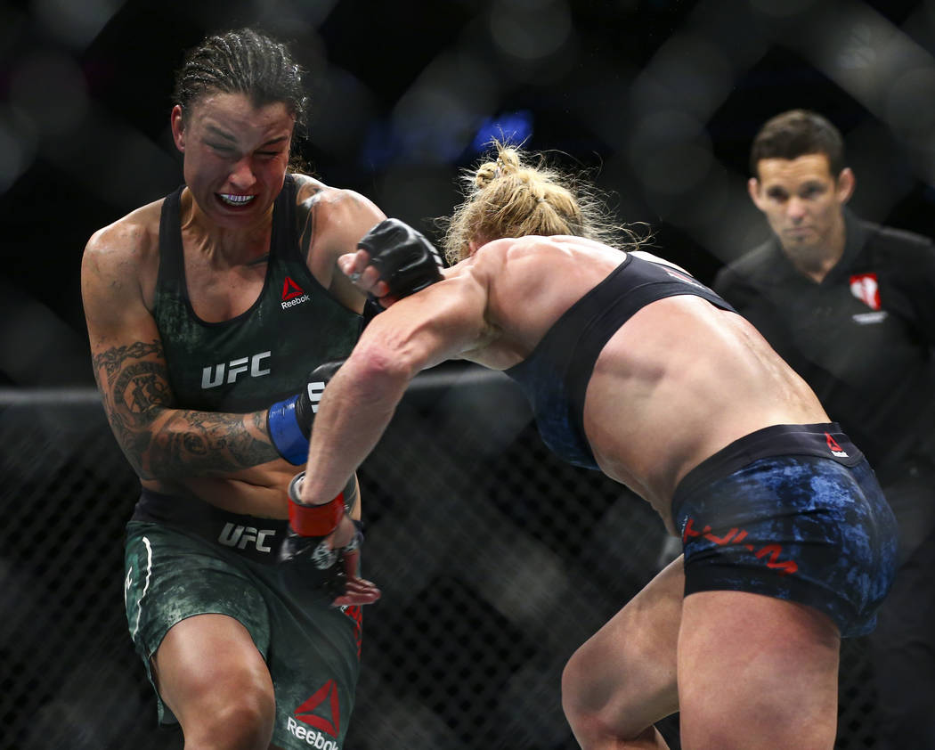 Raquel Pennington, left, fights Holly Holm during their bantamweight bout at UFC 246 at T-Mobil ...