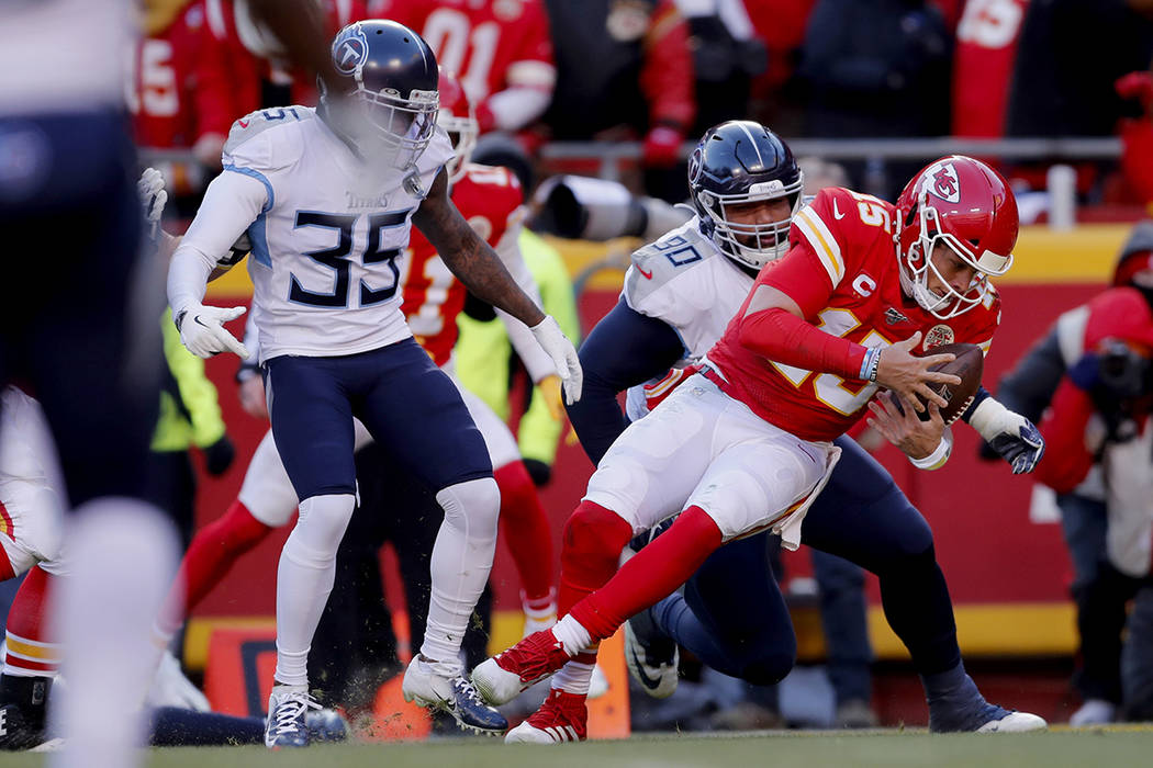 Kansas City Chiefs' Patrick Mahomes runs for a touchdown past Tennessee Titans defensive tackle ...