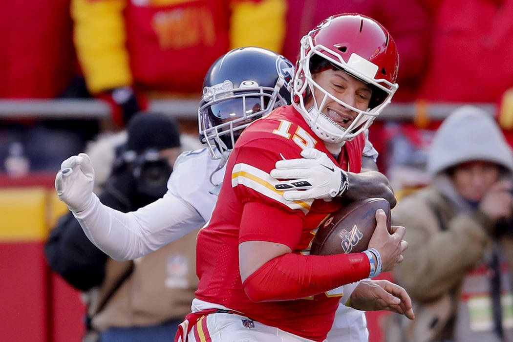 Kansas City Chiefs' Patrick Mahomes (15) runs for a touchdown against Tennessee Titans defensiv ...