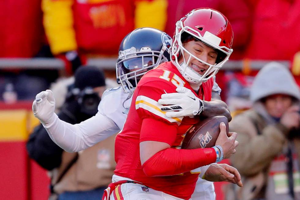 Kansas City Chiefs' Patrick Mahomes (15) runs for a touchdown against Tennessee Titans defensiv ...