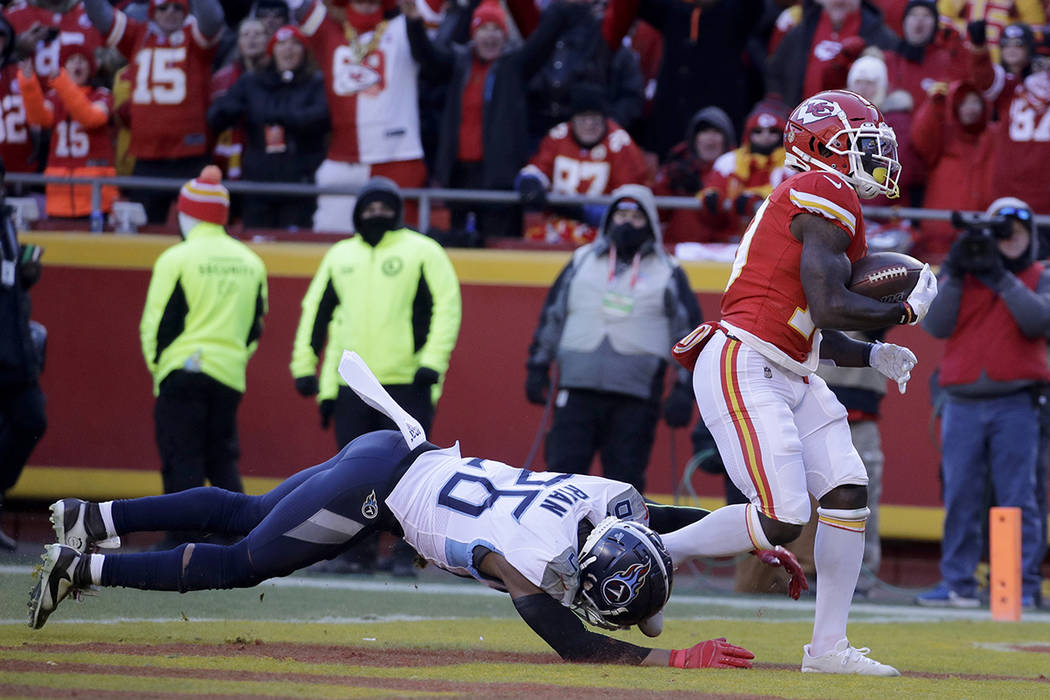 Kansas City Chiefs' Tyreek Hill catches a touchdown pass in front of Tennessee Titans' Logan Ry ...